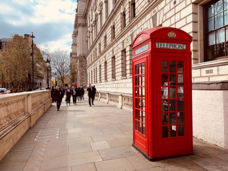 red telephone booth near building
